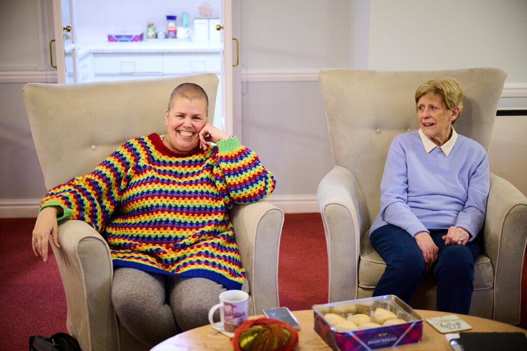 Communal lounge friends sharing tea in retirement community