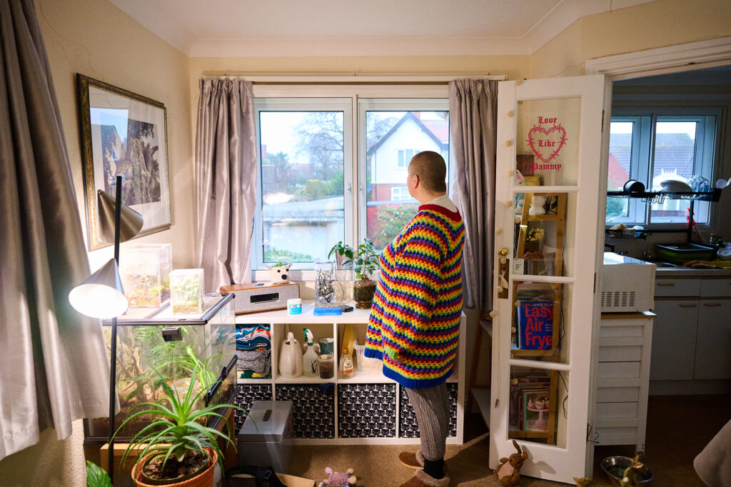 Resident looking out of the retirement rental window 