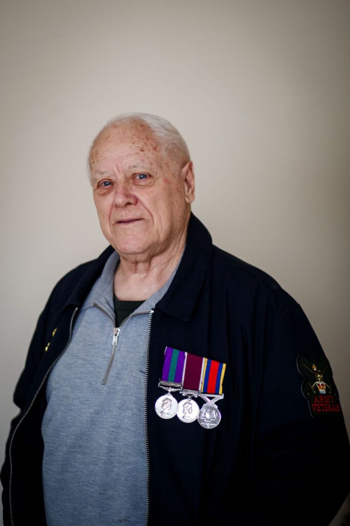 Ken Girling resident with armed forces medal