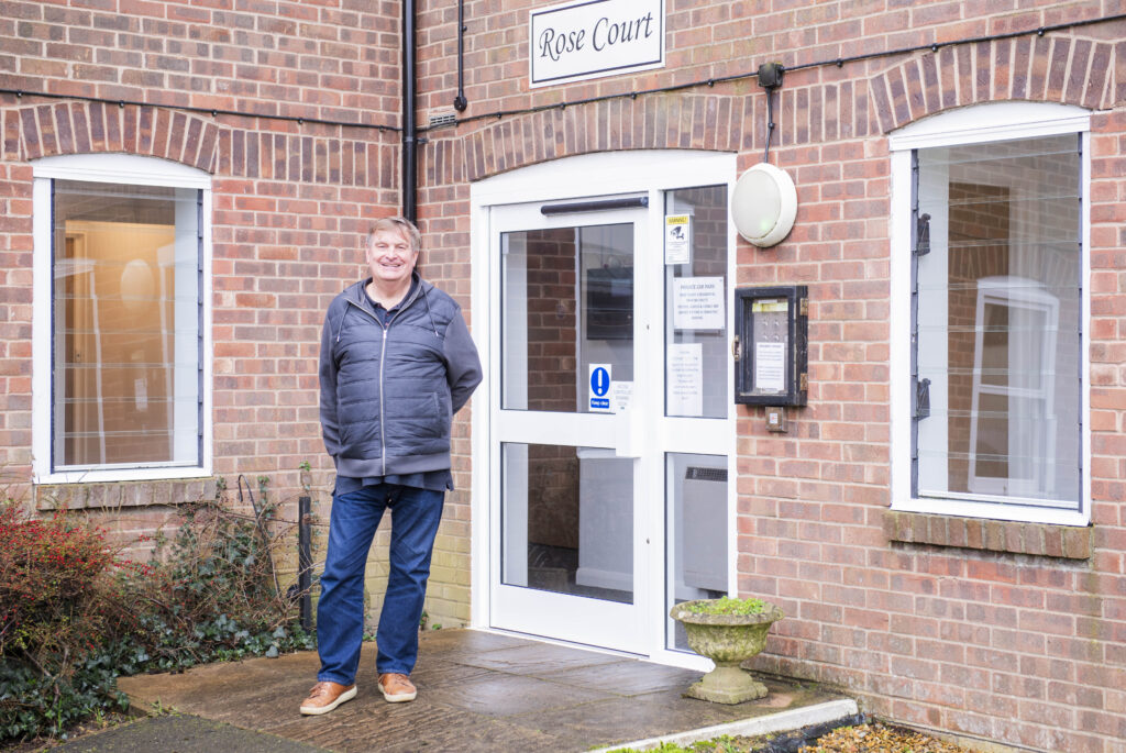 Retiree at the front of retirement development Rose Court in Littlehampton
